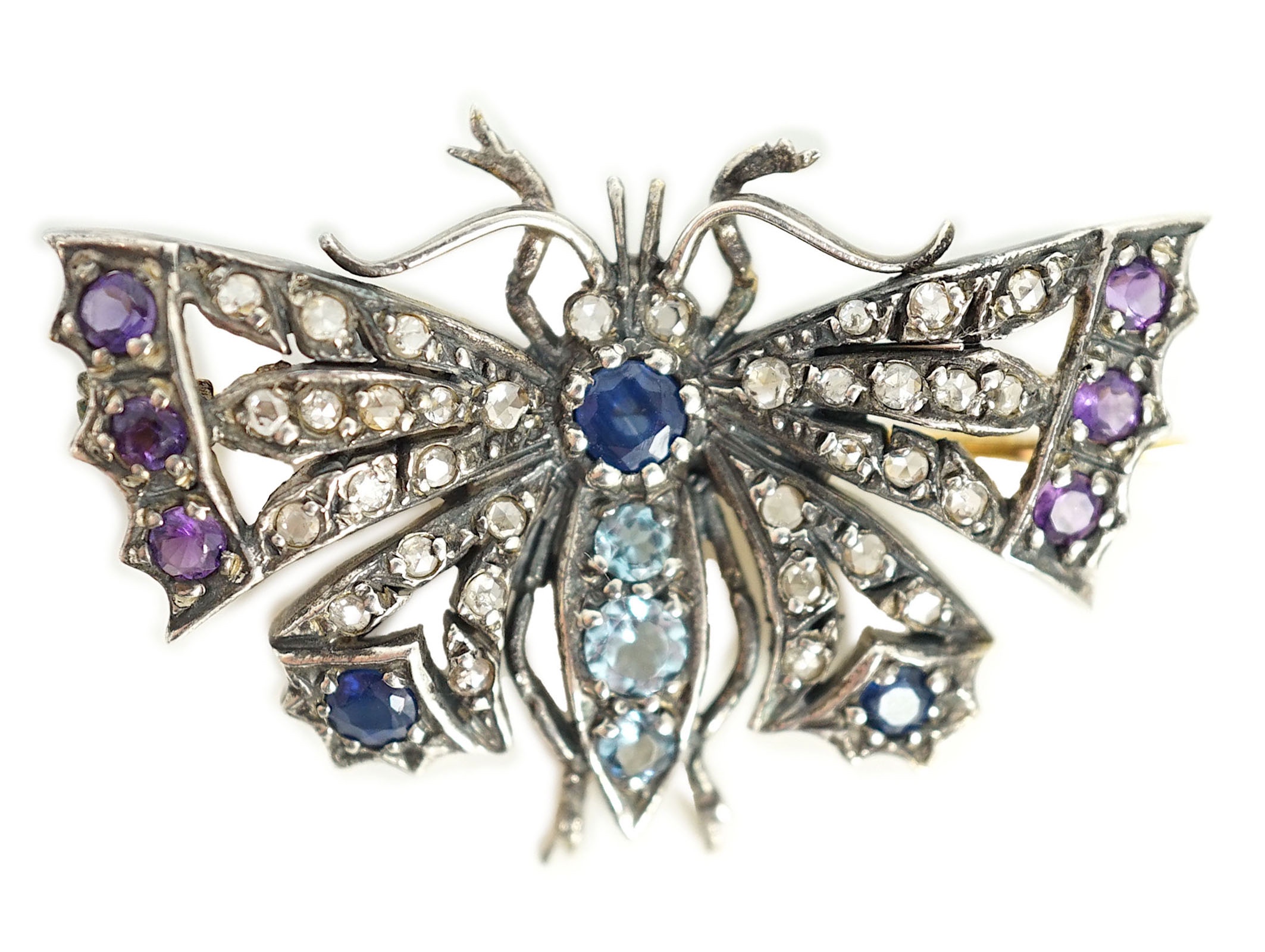 A Victorian gold and silver, diamond, amethyst, sapphire and aquamarine? set butterfly brooch